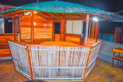 a cage with a table in the middle of a room at Casa de Madera The Wooden House Staycation Transient and Private Resort in Cabuyao