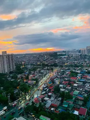 a city with a lot of buildings and a river at Suite 2253 in Manila