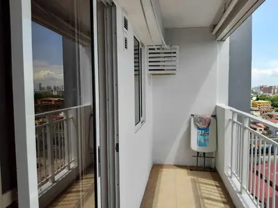 an apartment balcony with a view of the city at Sorrel Residences- 2 Bedroom Apartment in Manila