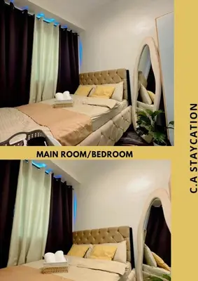 a room with two beds and a man room bedoren at CA Staycation in Manila