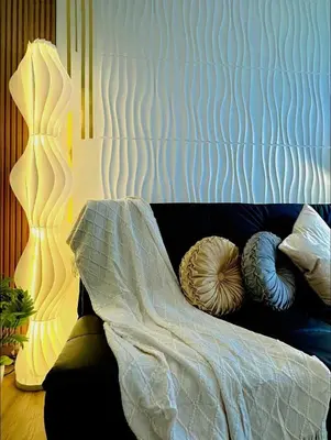a bedroom with a bed with pillows on it at CA Staycation in Manila