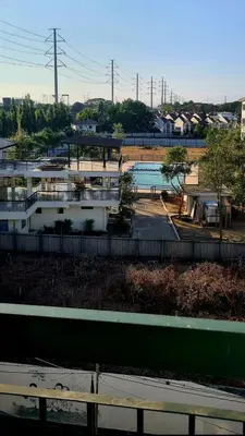 a view of a building with a parking lot at HeRo's Lair - Staycation near EK with Ps4 & more! in Santa Rosa