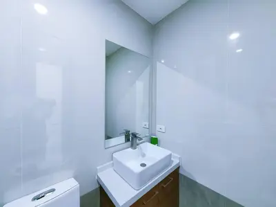 a bathroom with a sink and a mirror at 1BR Condotel Suite at Sunshine100 City Plaza #SS06 in Manila