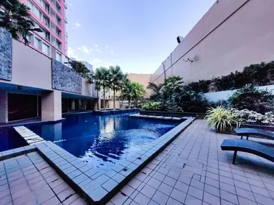 a swimming pool in the middle of a building at 1BR Condotel Suite at Sunshine100 City Plaza #SS05 in Manila