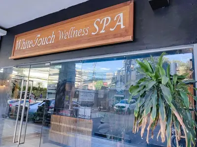 a sign for a white porch wellness spa on a store window at 1BR Condotel Suite at Sunshine100 City Plaza #SS04 in Manila