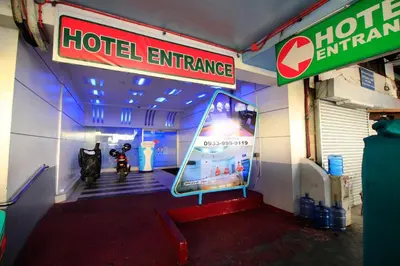 a hotel entrance with a man on a motorcycle in a room at Astrotel Avenida in Manila