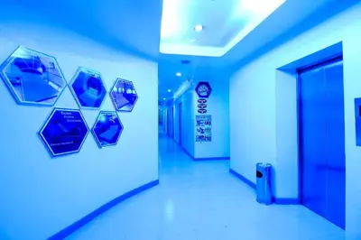 a hallway in an office building with blue lights at Astrotel Avenida in Manila