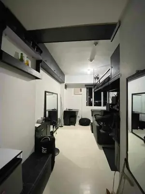 a room with a living room and a room with at Khencob's Pad Quezon City in Manila