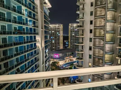 a view from a balcony of two tall buildings at 1BR Condotel at Azure Urban Resort Near Airport #AZ03 in Manila