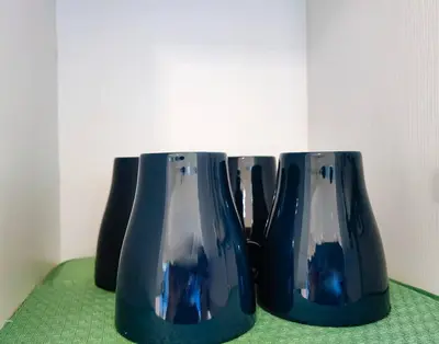 three blue vases sitting on a green table at 1BR Condotel at Azure Urban Resort Near Airport #AZ03 in Manila