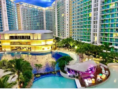 an aerial view of a resort with palm trees and buildings at 1BR Condotel at Azure Urban Resort Near Airport #AZ01 in Manila