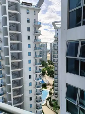an aerial view of two tall buildings and a pool at 1BR Condotel at Azure Urban Resort Near Airport #AZ02 in Manila