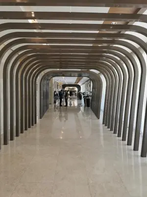a long hallway with columns in a building at Shore 3 residence mall 'of Asia in Manila