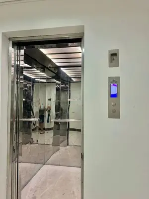 an entrance to a building with a glass door at Serenity Acqua Inn Beside Enchanted Kingdom in Santa Rosa