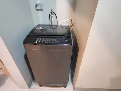 a computer sitting in a corner of a room at BGC Uptown Parksuites King Bed with Balcony Sunset and City View in Manila