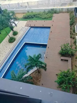 an overhead view of a swimming pool in a building at Cozy 642 shore3 residence tower2 near MOA in Manila