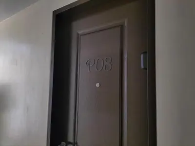 an elevator door with the number on it at STANFORD SUITES 3 in Silang