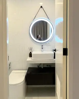 a bathroom with a sink and a mirror at Relax in style: Modern Airbnb and Netflix in Manila