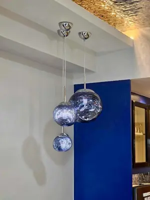 two lights hanging from the ceiling in a room at Deluxe Executive Corner Unit in Makati in Manila