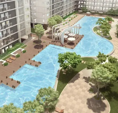an overhead view of a large swimming pool in a building at Cozy 1-bedroom unit in Shore 3 Residences in Manila