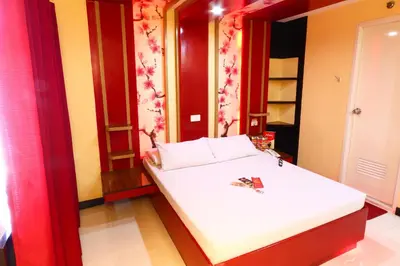 a small bedroom with a white bed in a room at Hotel Sogo Makati Avenue in Manila