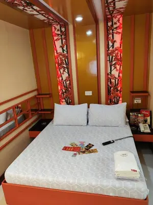 a bedroom with a bed with a white bedspread at Hotel Sogo Recto in Manila