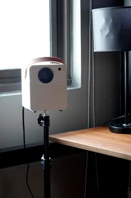 a camera on top of a table next to a window at WinTer Home Stay at S Residences Near Mall of Asia in Manila