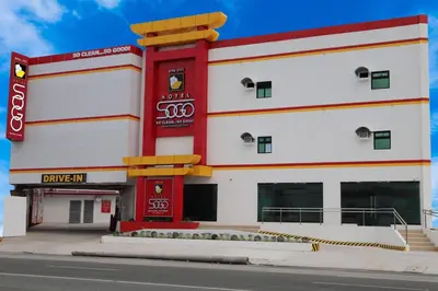 a large white building with a red and white at Hotel Sogo General Trias in General Trias