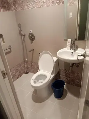 a bathroom with a toilet and a sink at Hotel Sogo General Trias in General Trias