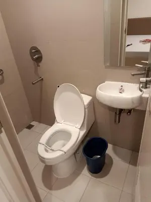 a bathroom with a toilet and a sink at Hotel Sogo General Trias in General Trias