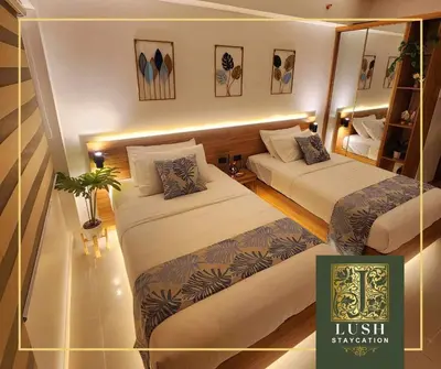 a small room with two beds and a mirror at Modern Condo Near Ayala Avenue Makati City CBD at Lush Residences in Manila