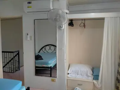 a room with a mirror and a bed in a room at San Isidro Cabuyao TRANSIENT in Banlik