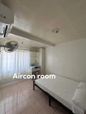 a bedroom with a bed in a room at San Isidro Cabuyao TRANSIENT in Banlik