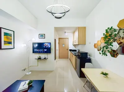 a room with a kitchen and a living room at 1BR Condotel with Balcony at SM Light Residences #LT06 in Manila
