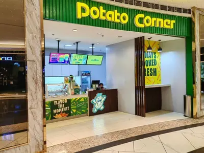 a polo corner restaurant with a person sitting at a counter at 1BR Condotel with Balcony at FAME Residences #FM14 in Manila