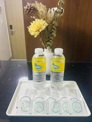 two bottles of water on a tray on a table at The Q's Place in Manila