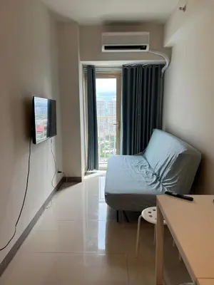 a hospital room with a bed and a window at SMDC Coast Residences in Manila