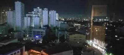 a view of a city at night with buildings at CasaMontero@UrbanDecaTowers EDSA in Manila
