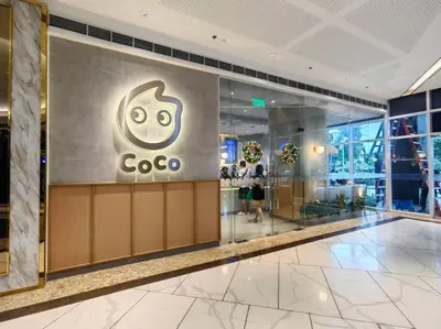 a cisco store in a building with a sign on the wall at 1BR Condotel with Balcony at FAME Residences #FM22 in Manila