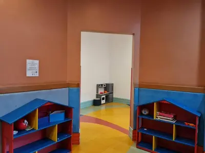 a room with blue and orange walls and a door at Big 2BR near Burgos Circle, Highstreet, St Lukes - B Parklane T1 in Manila