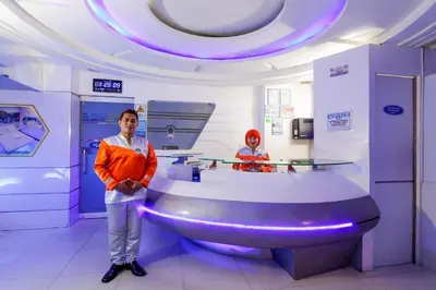 a man standing next to a sink in a room at Astrotel Guadalupe in Manila