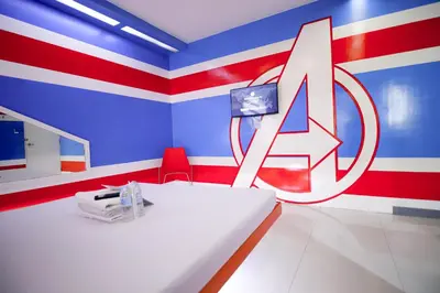 a room with a red white and blue wall at Astrotel Divisoria in Manila