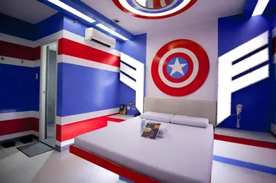 a bedroom with a captain america painted on the wall at Astrotel Divisoria in Manila