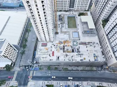 an overhead view of a building under construction in a city at 1BR Condotel with Balcony at FAME Residences #FM30 in Manila