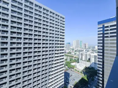 an overhead view of a large building in a city at 1BR Condotel with Balcony at FAME Residences #FM32 in Manila