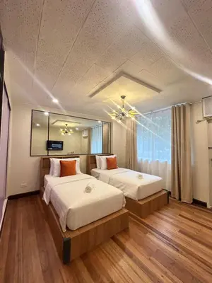 a bedroom with two beds and a large window at Makati Medical City Accommodation in Manila