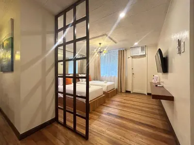 a room with a ladder to a bed in it at Makati Medical City Accommodation in Manila