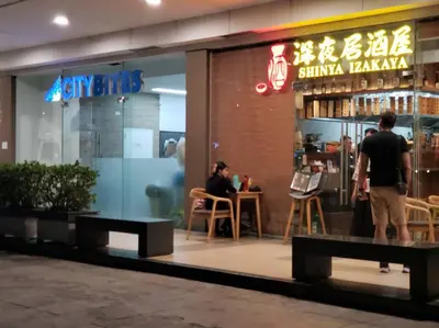 a group of people standing outside of a restaurant at JoVis Place Staycation near MOA(Wifi & Netflix) in Manila