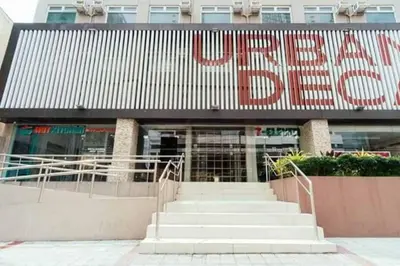 a building with a large sign on the front of it at Urban Deca Tower OYO 2 in Manila