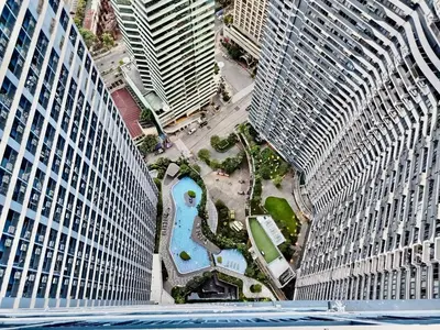 an aerial view of a city with tall buildings at Air Residence-Sunset & City Views Await in Manila